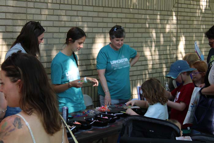 Teen volunteers leading yard games