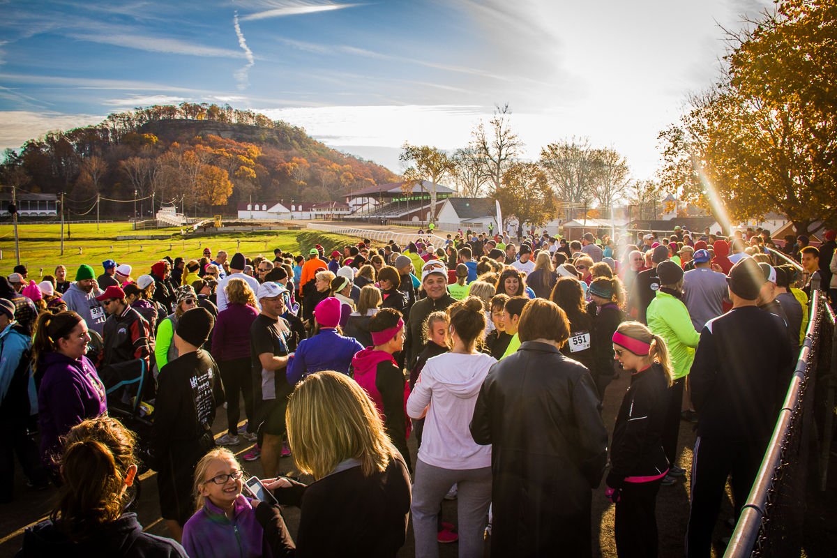 Runners and walkers gathered at the start line at the Fairfield County Fairgrounds on a sunny fall morning