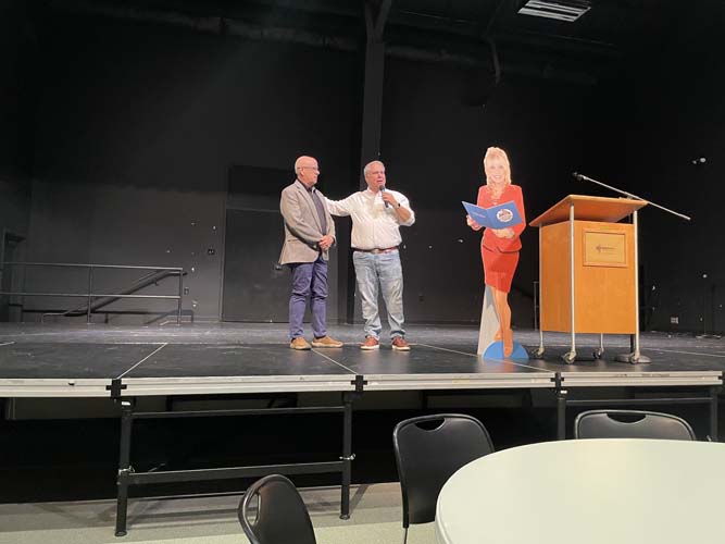 Two speakers at the podium during the kick-off program