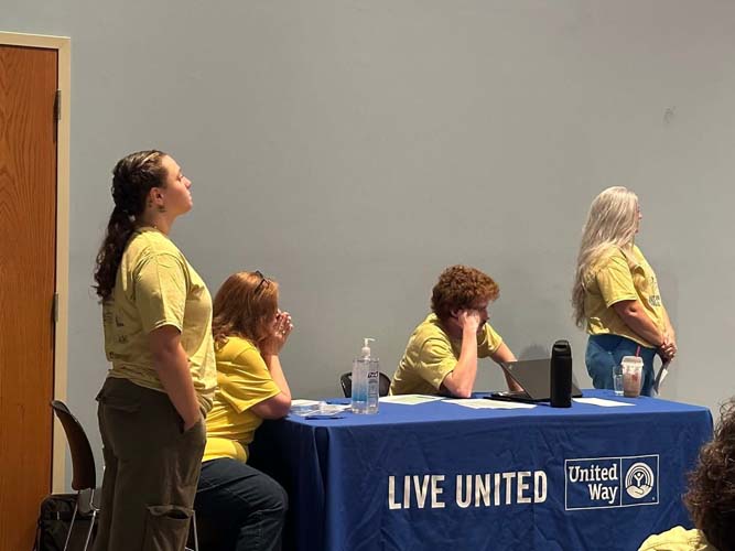 Volunteers staffing the Live United check-in table