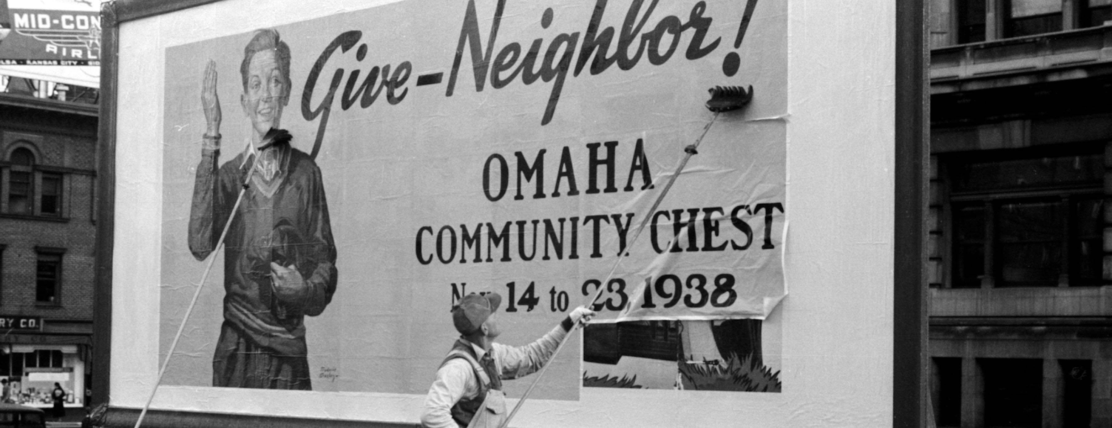 A worker pasting up a 1938 Community Chest &ldquo;Give-Neighbor!&rdquo; billboard
