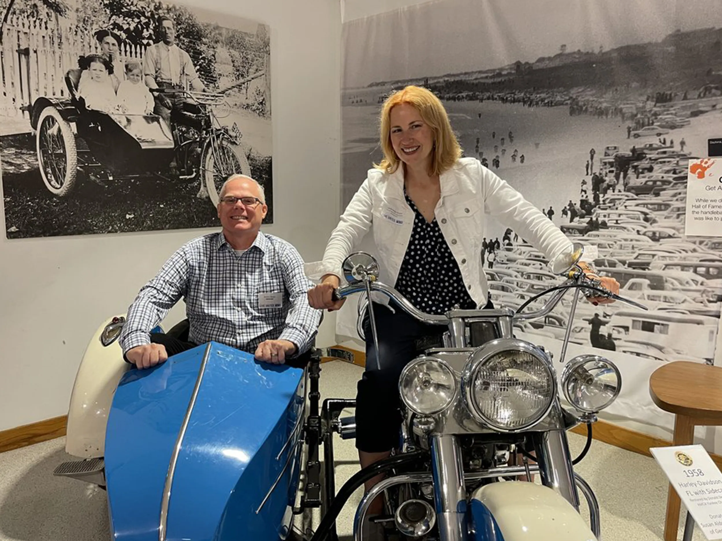 Two guests aboard a vintage Harley-Davidson with sidecar at the reception venue