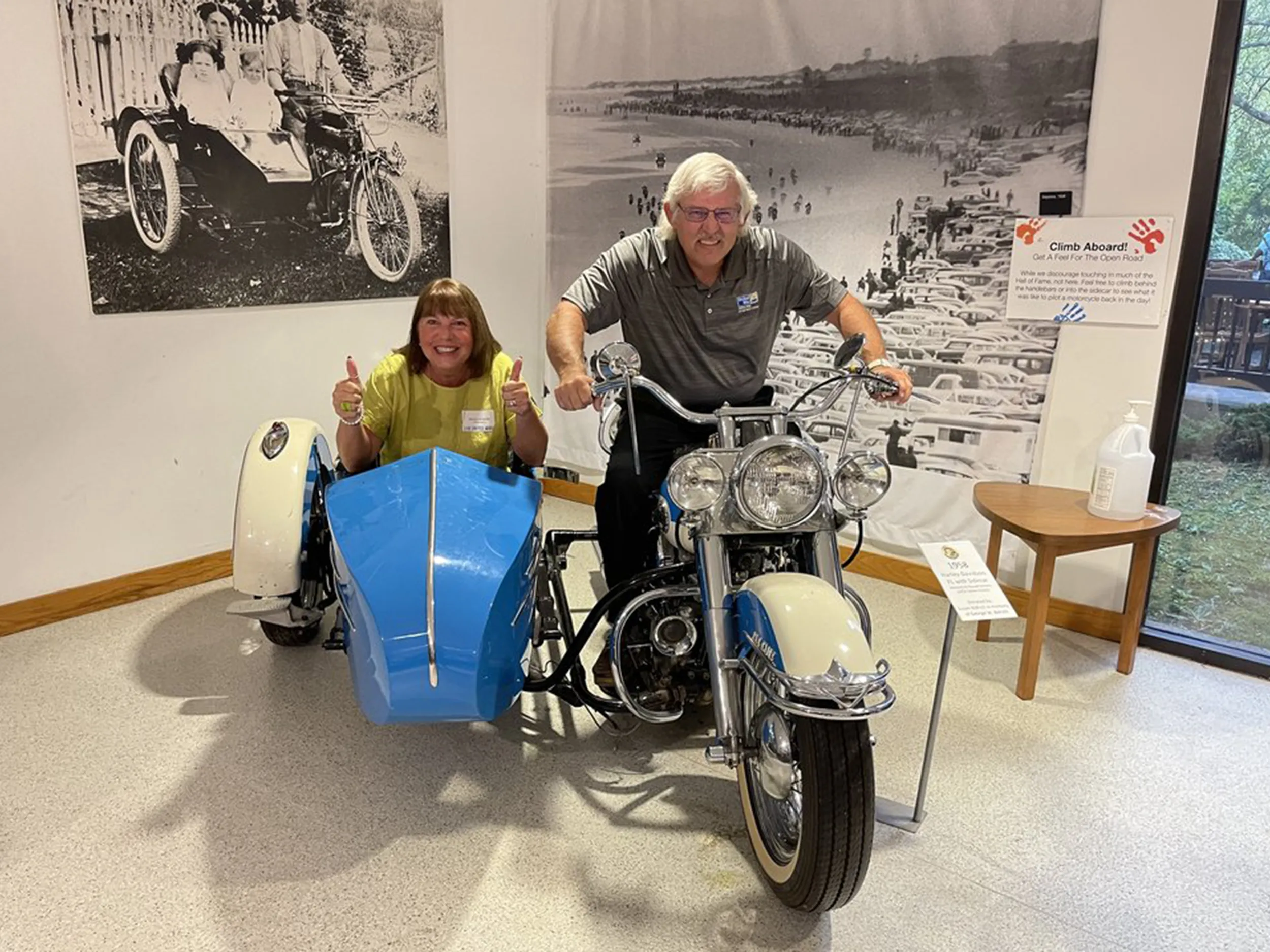 Guests giving a thumbs up from the motorcycle and sidecar